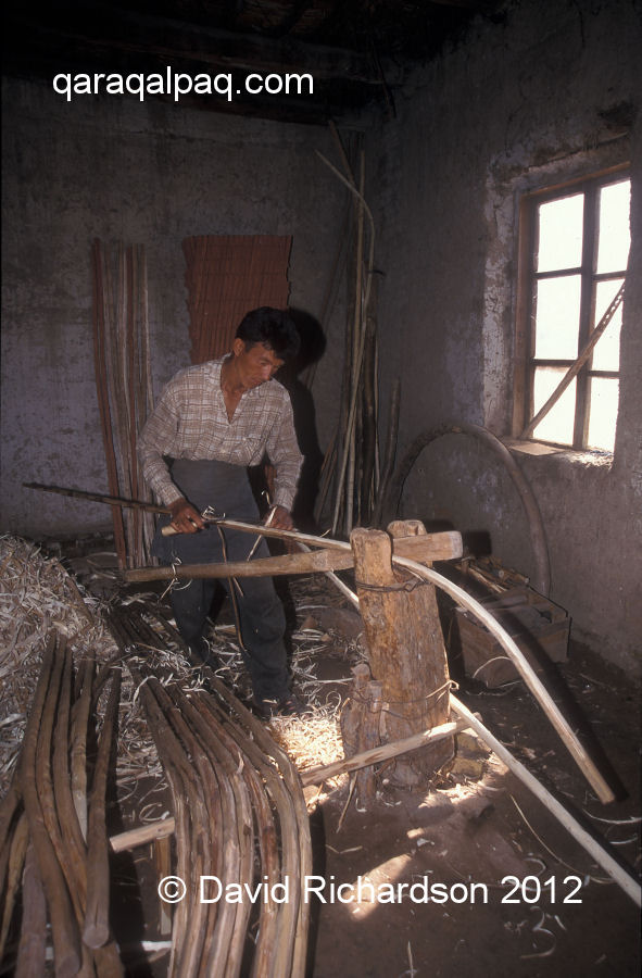 Shaving the bent poles to make the finished uyiqs